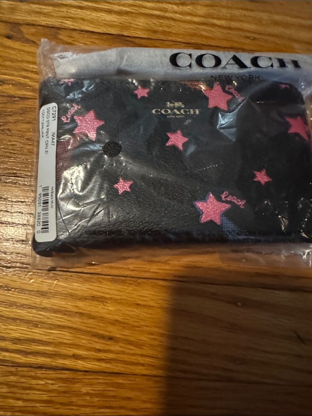 COACH Black Leather wristlet with Pink Star Accents